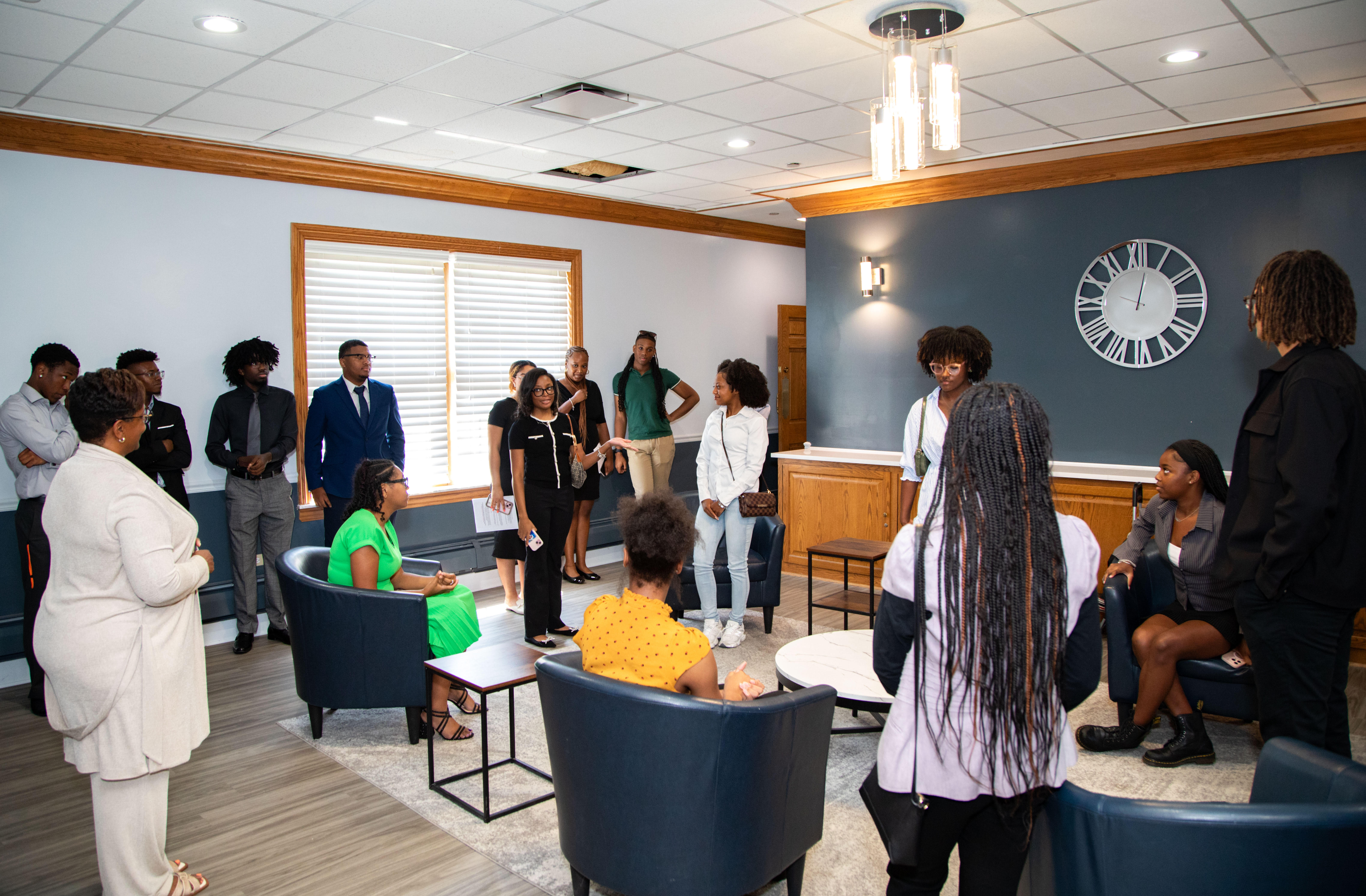 Mentoring — group gathered in a hallway lounge
