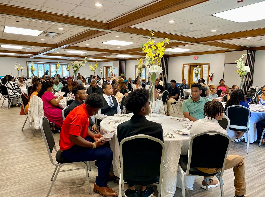 PLAN4SUCCESS community event — students and supporters gathered at a program session